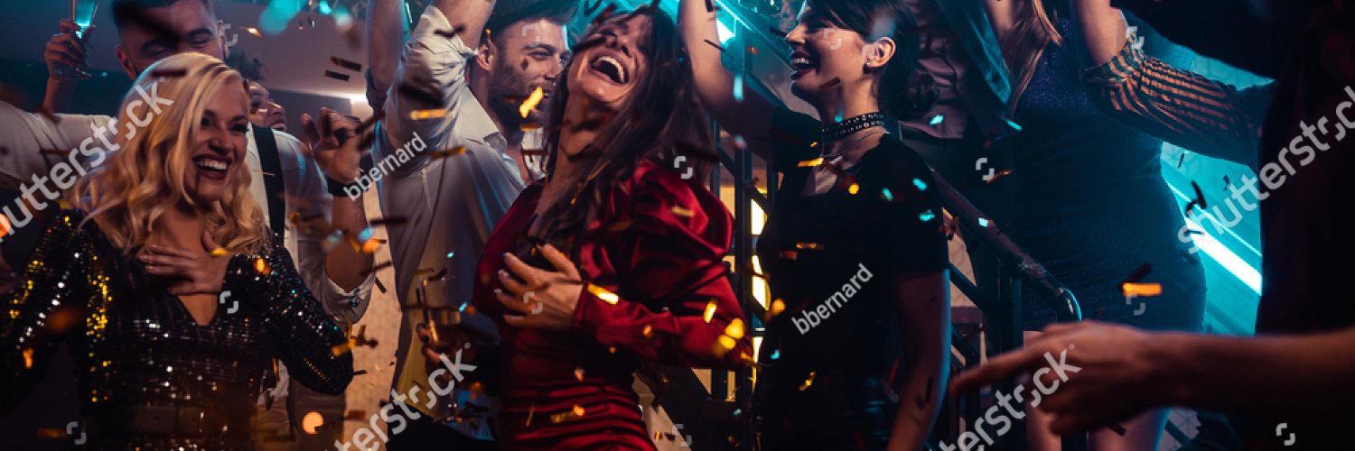 stock photo group of young friends drinking alcohol and dancing together in the nightclub 1983178619