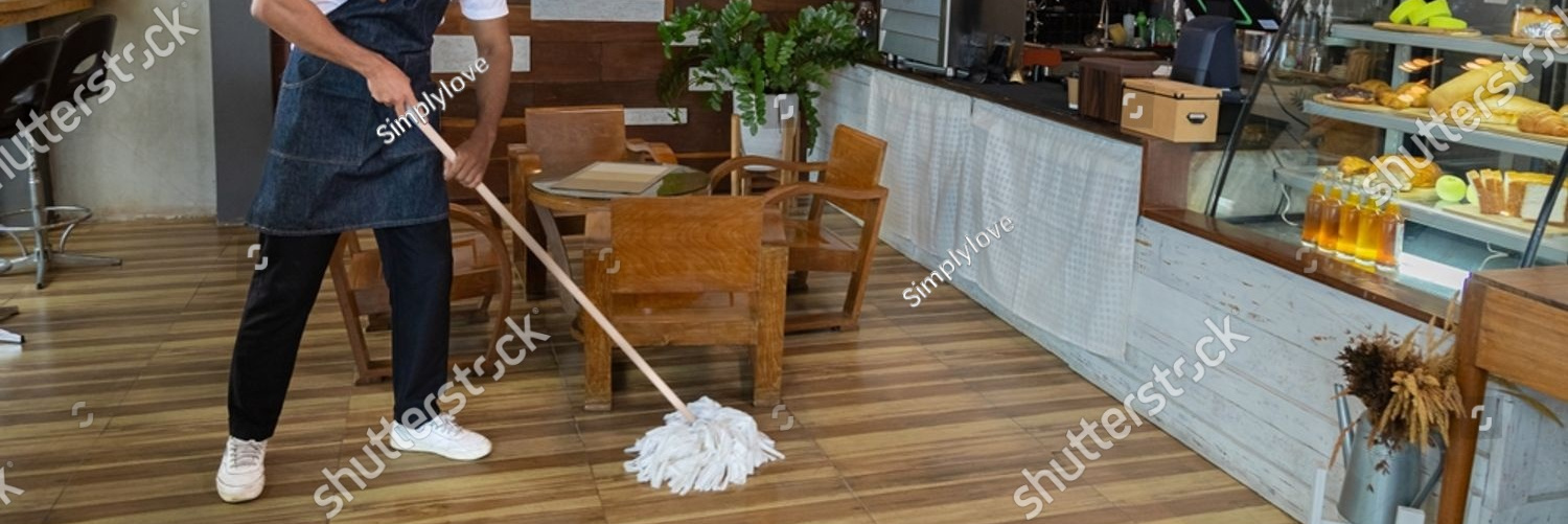 stock photo waiters handsome indian wearing apron mopping the floor in cafe and bakery preparing to support 2356966351