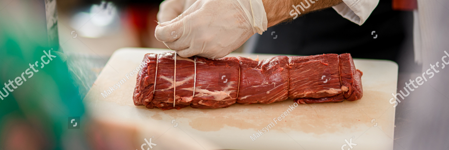 stock photo close up view on piece of raw meat and chef s hands which tie it with butcher s twine 2003954585